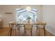 Dining room with a natural wood table and a view into the living room at 2663 Marcia Dr, Lawrenceville, GA 30044