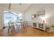 Open dining area with hardwood floors, modern furniture and a view of the living room at 2663 Marcia Dr, Lawrenceville, GA 30044