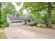 Exterior view of home with a long driveway and well-maintained lawn at 2663 Marcia Dr, Lawrenceville, GA 30044
