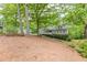Home nestled amongst trees and landscaping at 2663 Marcia Dr, Lawrenceville, GA 30044