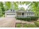 Charming home featuring a stone front porch and attached garage at 2663 Marcia Dr, Lawrenceville, GA 30044