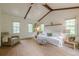 Bright living room featuring vaulted ceilings, exposed beams, and natural light at 2663 Marcia Dr, Lawrenceville, GA 30044