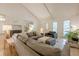 Bright living room with large windows, hardwood floors, and a comfortable seating area at 2663 Marcia Dr, Lawrenceville, GA 30044