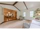 Sun-lit living room with open floor plan, exposed beams, and cozy furniture at 2663 Marcia Dr, Lawrenceville, GA 30044