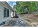 Backyard boasts a stone path, a private fence, and lush greenery at 3003 Heavenly Ln, Snellville, GA 30078