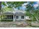 The backyard offers a screened-in porch, patio, landscaping, and a serene outdoor retreat at 3003 Heavenly Ln, Snellville, GA 30078