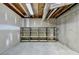 Unfinished basement with exposed ceiling, concrete walls, and ample storage at 3003 Heavenly Ln, Snellville, GA 30078
