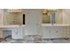 Bathroom boasts dual sinks, modern fixtures, and ample counter space on marble floors at 3003 Heavenly Ln, Snellville, GA 30078