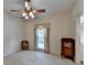 This bedroom features neutral carpeting, a ceiling fan, and a double window at 3003 Heavenly Ln, Snellville, GA 30078