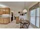 Bright breakfast nook with views to kitchen; features a round table and natural light at 3003 Heavenly Ln, Snellville, GA 30078
