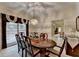 Elegant dining room with wood table, chandelier, and natural light at 3003 Heavenly Ln, Snellville, GA 30078