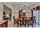 Inviting dining room with a well-lit space, a classic light fixture, and elegant furniture at 3003 Heavenly Ln, Snellville, GA 30078