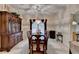 Formal dining room with a large cabinet and chandelier lighting at 3003 Heavenly Ln, Snellville, GA 30078