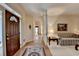 Open foyer with hardwood floors, decorative rug, and view to the living room at 3003 Heavenly Ln, Snellville, GA 30078