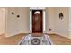 Well-lit foyer with hardwood floors and a decorative area rug at 3003 Heavenly Ln, Snellville, GA 30078