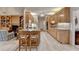 Open kitchen with granite countertops, island seating, and seamless access to living area at 3003 Heavenly Ln, Snellville, GA 30078