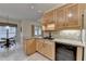 Updated kitchen with stainless steel dishwasher and sink, granite countertops, and views to breakfast nook at 3003 Heavenly Ln, Snellville, GA 30078