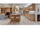Spacious open kitchen with island seating and direct views into the living area with built-in bookshelves at 3003 Heavenly Ln, Snellville, GA 30078