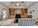 This living room boasts large built-in bookshelves, fireplace, and plush seating at 3003 Heavenly Ln, Snellville, GA 30078