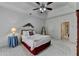 A view of the main bedroom, featuring a ceiling fan and a plush bed at 3003 Heavenly Ln, Snellville, GA 30078