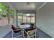Inviting screened porch perfect for relaxing, featuring a seating area and outdoor view at 3003 Heavenly Ln, Snellville, GA 30078