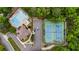 Aerial view of a swimming pool, clubhouse, and tennis courts at 310 Tradea Tarn, Roswell, GA 30076