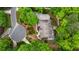 Aerial view of a house surrounded by green trees at 310 Tradea Tarn, Roswell, GA 30076