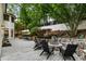 Backyard with a large deck, seating area, and landscaped gardens at 310 Tradea Tarn, Roswell, GA 30076