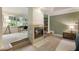 Bright bedroom features a fireplace, space for a desk, and a neutral color palette at 310 Tradea Tarn, Roswell, GA 30076