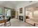 Spacious bedroom with fireplace, vaulted ceilings, and bright light from large window at 310 Tradea Tarn, Roswell, GA 30076