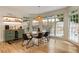 Dining room with hardwood floors, large windows, and built-in storage at 310 Tradea Tarn, Roswell, GA 30076