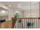 Upstairs hallway features a wood floor, and a foyer with stairs leading to the main floor at 310 Tradea Tarn, Roswell, GA 30076