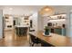 Bright, open kitchen features a large island, stainless steel appliances, and an adjacent dining area at 310 Tradea Tarn, Roswell, GA 30076