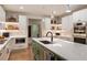 Well-appointed kitchen boasts a large island, modern appliances, and ample counter space for cooking at 310 Tradea Tarn, Roswell, GA 30076