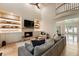 Spacious living room with a fireplace, custom shelves, a balcony, and expansive windows providing ample natural light at 310 Tradea Tarn, Roswell, GA 30076