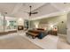 Spacious primary bedroom with a fireplace, sitting area, and a king-size bed at 310 Tradea Tarn, Roswell, GA 30076