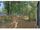 Spacious back deck surrounded by mature trees, ideal for outdoor relaxation at 785 Redland Dr, Jonesboro, GA 30238