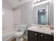 Compact bathroom features a vanity sink, toilet, and shower-tub combo for essential hygiene needs at 785 Redland Dr, Jonesboro, GA 30238
