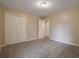 Bedroom with neutral carpet and double closet doors for maximum storage at 785 Redland Dr, Jonesboro, GA 30238