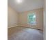 Comfortable bedroom boasts plush carpeting, a bright window, and neutral walls for a relaxing atmosphere at 785 Redland Dr, Jonesboro, GA 30238