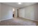 Inviting bedroom boasts plush carpeting, neutral tones, and access to a bathroom and closet for added convenience at 785 Redland Dr, Jonesboro, GA 30238