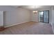 Dining room features a modern chandelier and sliding glass doors to the backyard at 785 Redland Dr, Jonesboro, GA 30238