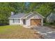 Charming single-story home with vinyl siding, an attached garage, and a well-maintained front yard at 785 Redland Dr, Jonesboro, GA 30238