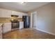 Bright kitchen with white cabinets, modern appliances, offering ample space for meal preparation and dining at 785 Redland Dr, Jonesboro, GA 30238