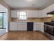 Well-lit kitchen with white cabinets, tiled backsplash, and modern appliances for a functional cooking space at 785 Redland Dr, Jonesboro, GA 30238