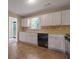 Functional kitchen boasts ample natural light, white cabinets, and modern appliances for efficient meal preparation at 785 Redland Dr, Jonesboro, GA 30238
