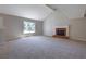 Spacious living room features a fireplace, neutral paint colors, and plush carpet at 785 Redland Dr, Jonesboro, GA 30238