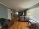 A spacious living room with hardwood floors, a large window and neutral color walls at 1230 Lloyd Dr, Forest Park, GA 30297