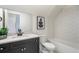 Modern bathroom with hexagon tile surround, matte black fixtures and a stylish aesthetic at 12520 Celestine Way, Milton, GA 30075