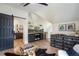 This bonus room includes a wet bar area, a sliding barn door, and decoratively displayed accent pieces at 12520 Celestine Way, Milton, GA 30075